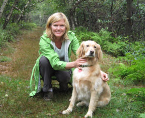 Mary Stone with her golden retriever Miss Ellie Mae along a trail at Big Pocono State Park