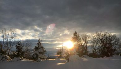a sunset in a winter snow at the Karen Ann Quinlan Home for Hospice