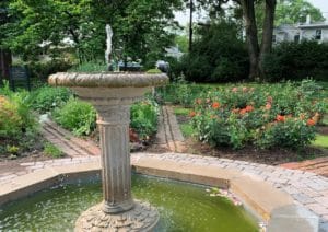 Avis Campbell Gardens octagonal pond with a pedestal fountain. 