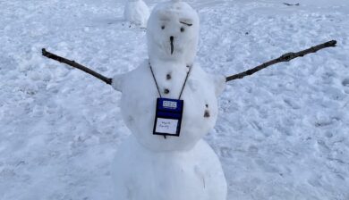 a snowman with a blue CZC tag around his neck with the name Mark Frosty