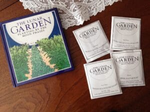a book titled The Lunar Garden Planting by the Moon in Phases plus four seed packs