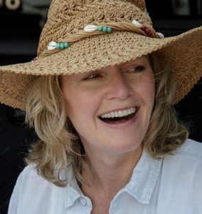 Head shot of Mary Stone in a straw hat