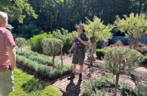 Patrick McDuffee leading a tour through the formal herb garden at Well-Sweep Herb Farm.