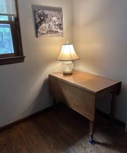Family cherry drop-leaf table in a room awaiting its next chapter